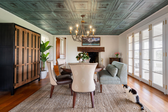 Green tin ceiling in traditional dinning room. 