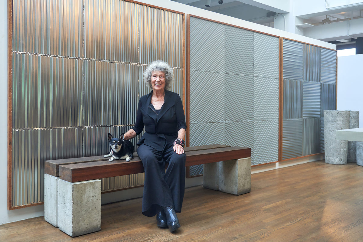 Clodagh, globally acclaimed designer, sitting Infront of her new American tin ceiling collection called Tara Collection by Clodagh 